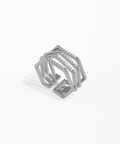 Silver geometric ring with small stones on a white background