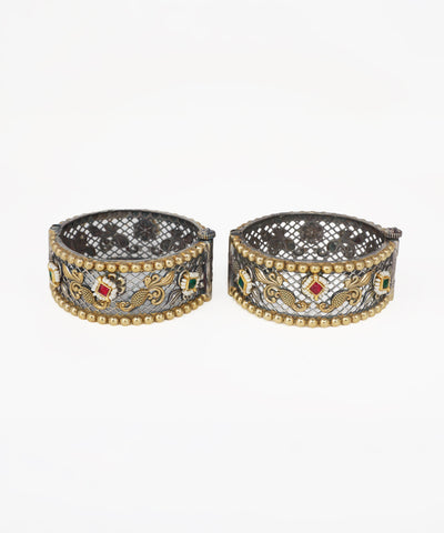 Oxidised and gold-tone bangle bracelets with red and green stones and faux pearls