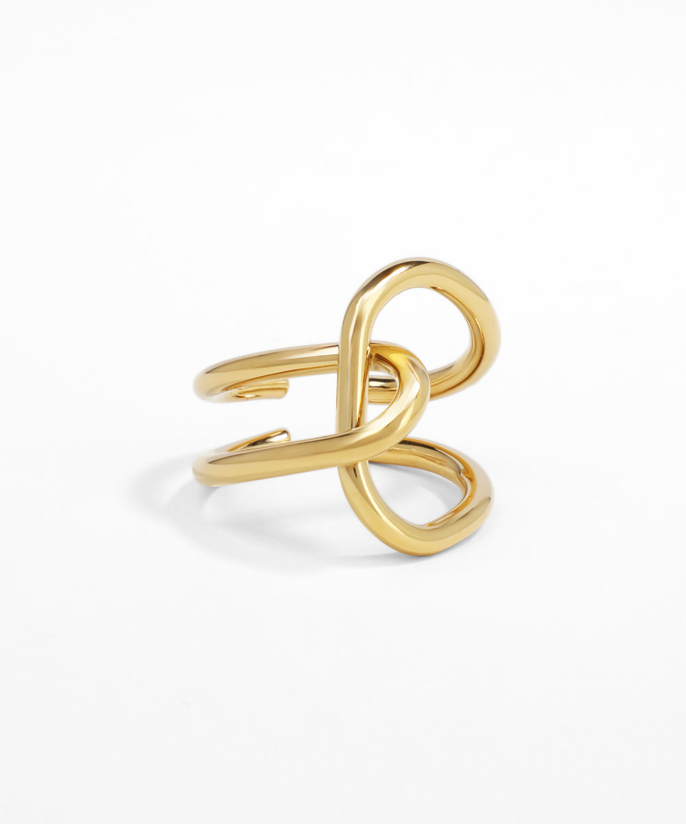 Gold infinity ring on a white background