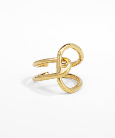 Gold infinity ring on a white background