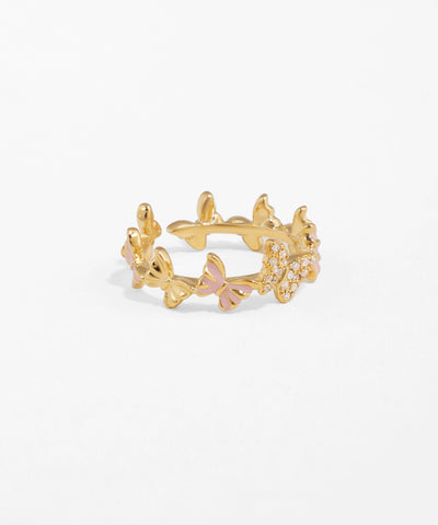 Gold ring with floral design on a white background