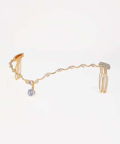Gold-tone tiara headpiece with wavy design and clear stone embellishments, featuring a central round stone drop