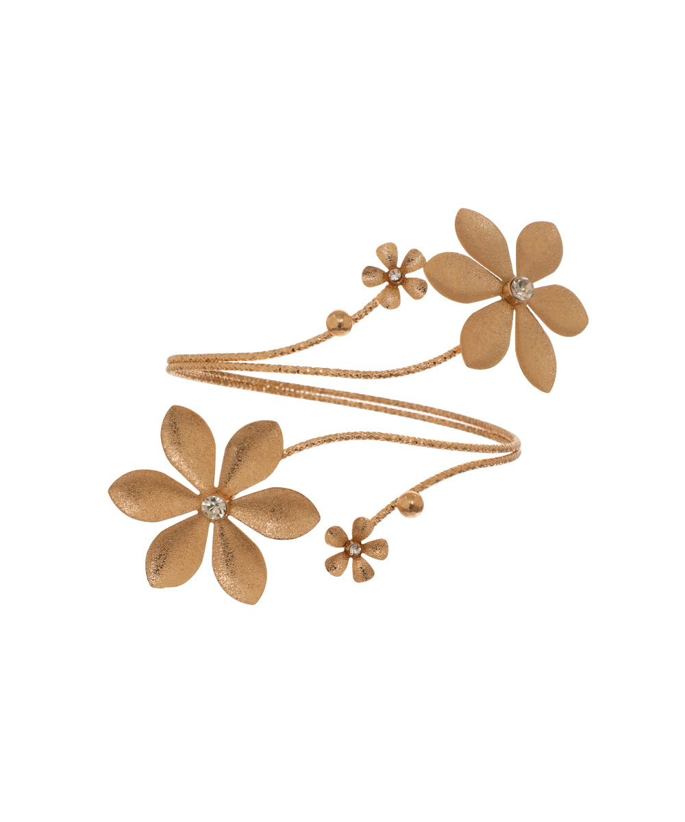 Gold-tone arm cuff with textured floral design and clear stones