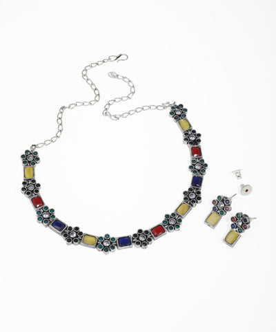 Oxidise necklace set with colorful rectangular stones and floral clusters featuring clear and green stones