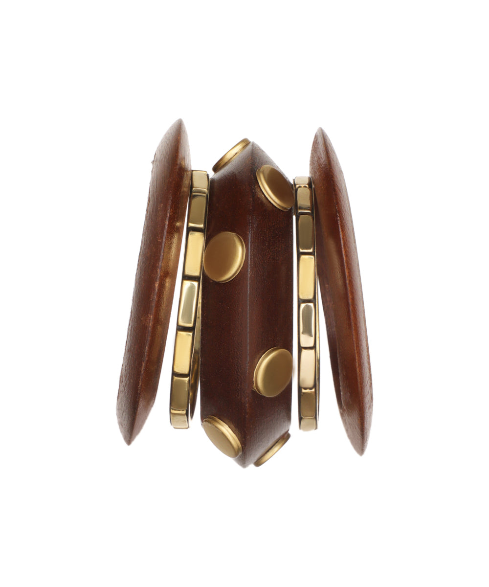 Gold-tone and brown wooden stacked bangles with geometric shapes and metal stud details