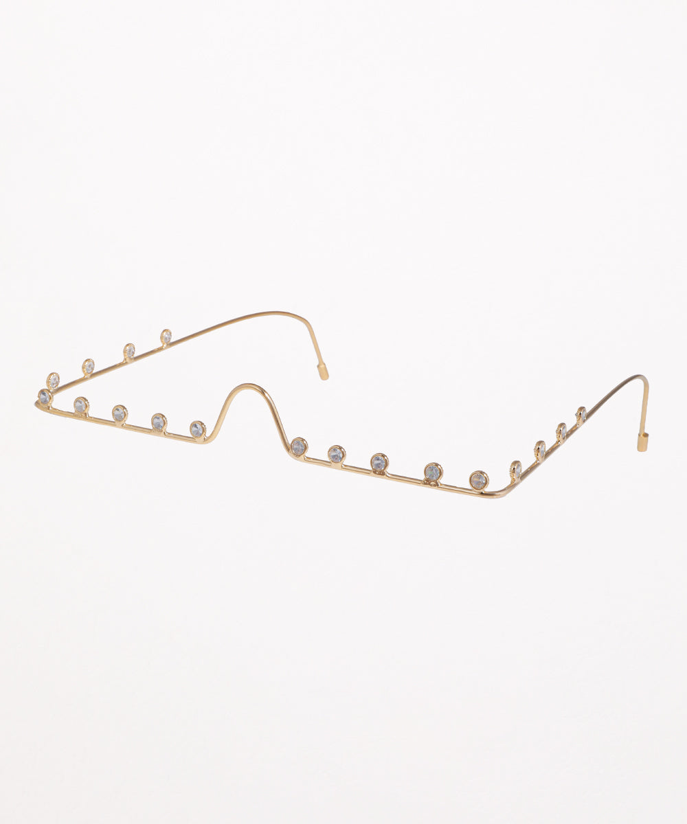 Gold-tone facelet with wavy outline and small clear CZ stones set along the frame