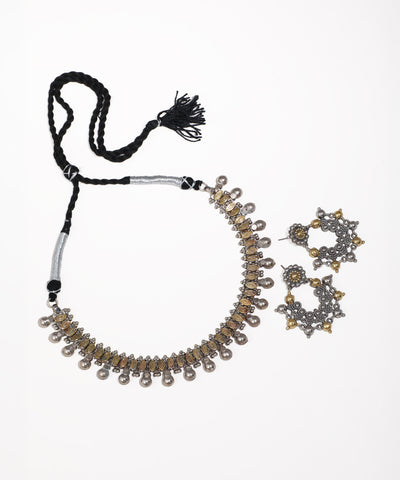 Oxidized finish necklace with oval motifs and bell drops, paired with matching circular earrings