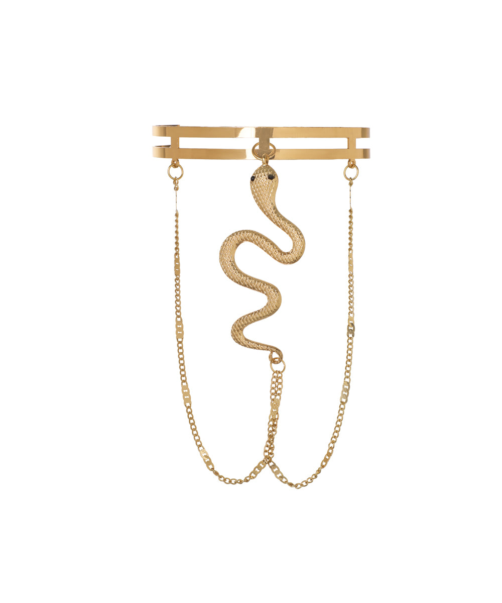 Gold-tone arm cuff with a dangling snake charm and draped chains.
