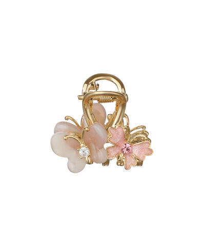 Gold-tone mini claw clip with butterfly and pink flower designs, accented with clear and pink stones