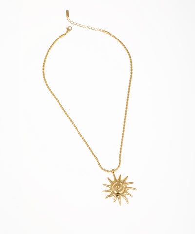 Gold-tone necklace with sunburst spiral pendant on a twisted rope chain