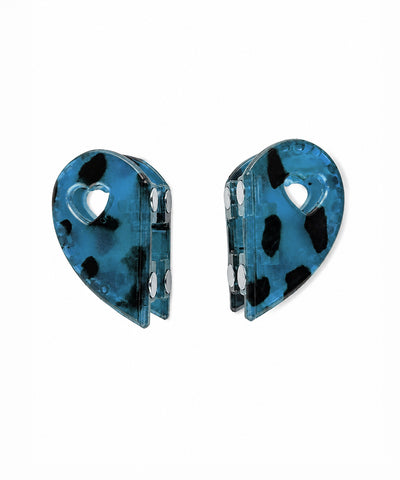 Translucent blue hair clip with black leopard spots and heart cut-out, magnetic closure