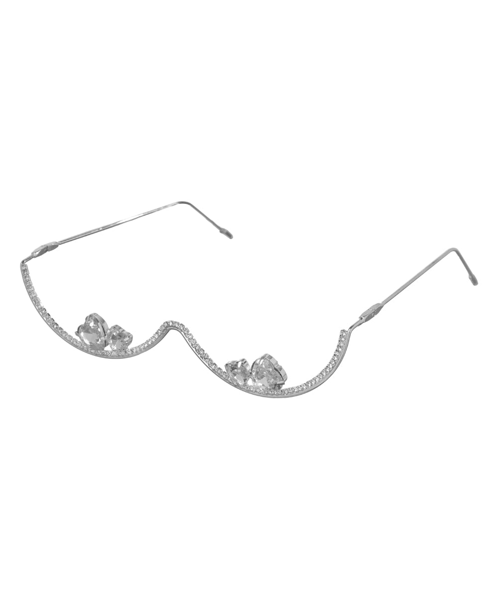 Rhodium finish facelet with wavy design and clear cubic zirconia stones.