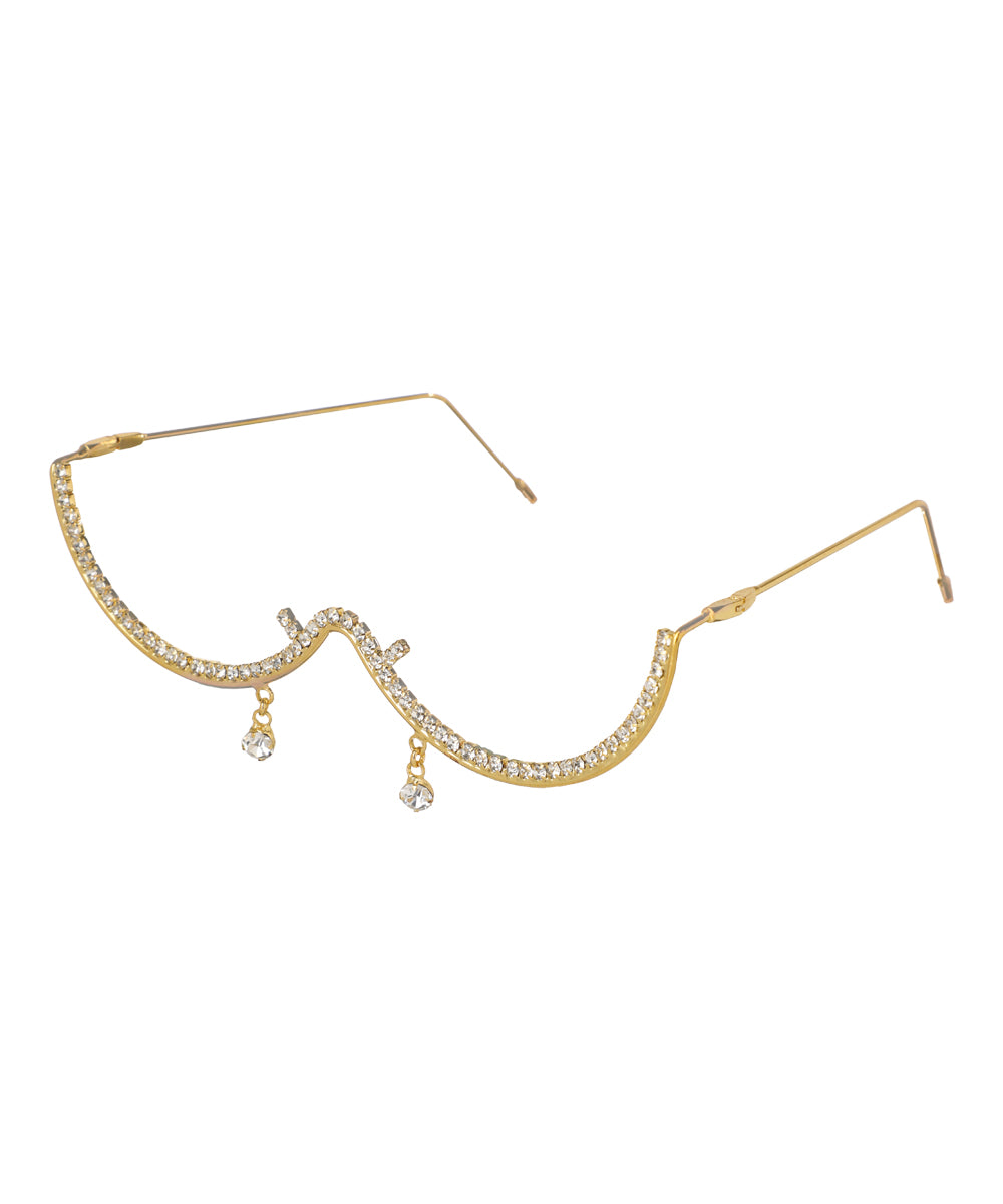 Gold-tone facelet with wavy design, lined with clear stones and two dangling accents