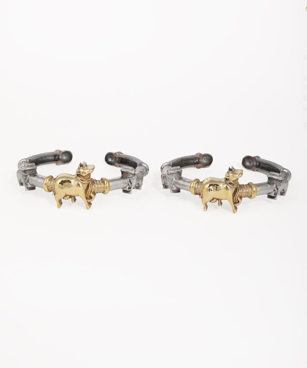 Oxidise kadas with gold-tone animal figures and textured bands, open cuff style