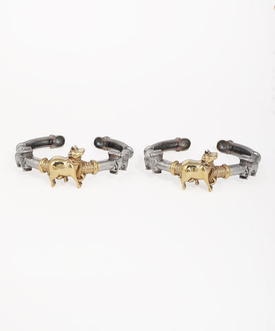 Oxidise kadas with gold-tone animal figures and textured bands, open cuff style