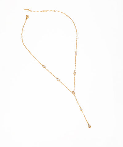 Gold-tone lariat necklace with multiple clear teardrop-shaped sparkling stone drops and a Y-chain design.