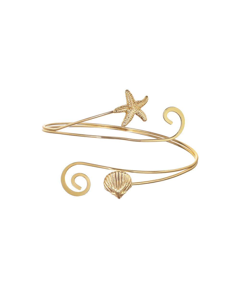 Gold-tone arm cuff with starfish and seashell motifs and spiraling bands