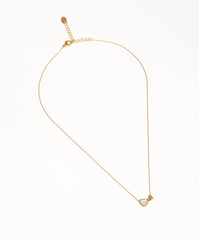 Gold-tone necklace with white heart inlay and small heart charm