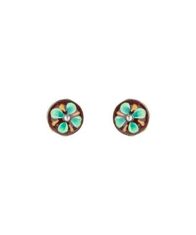 A pair of oval stud earrings with a vintage-style floral design. Each earring features a dark brown background with four light green and turquoise petals, a small white pearl-like center, and a gold-toned metal border.