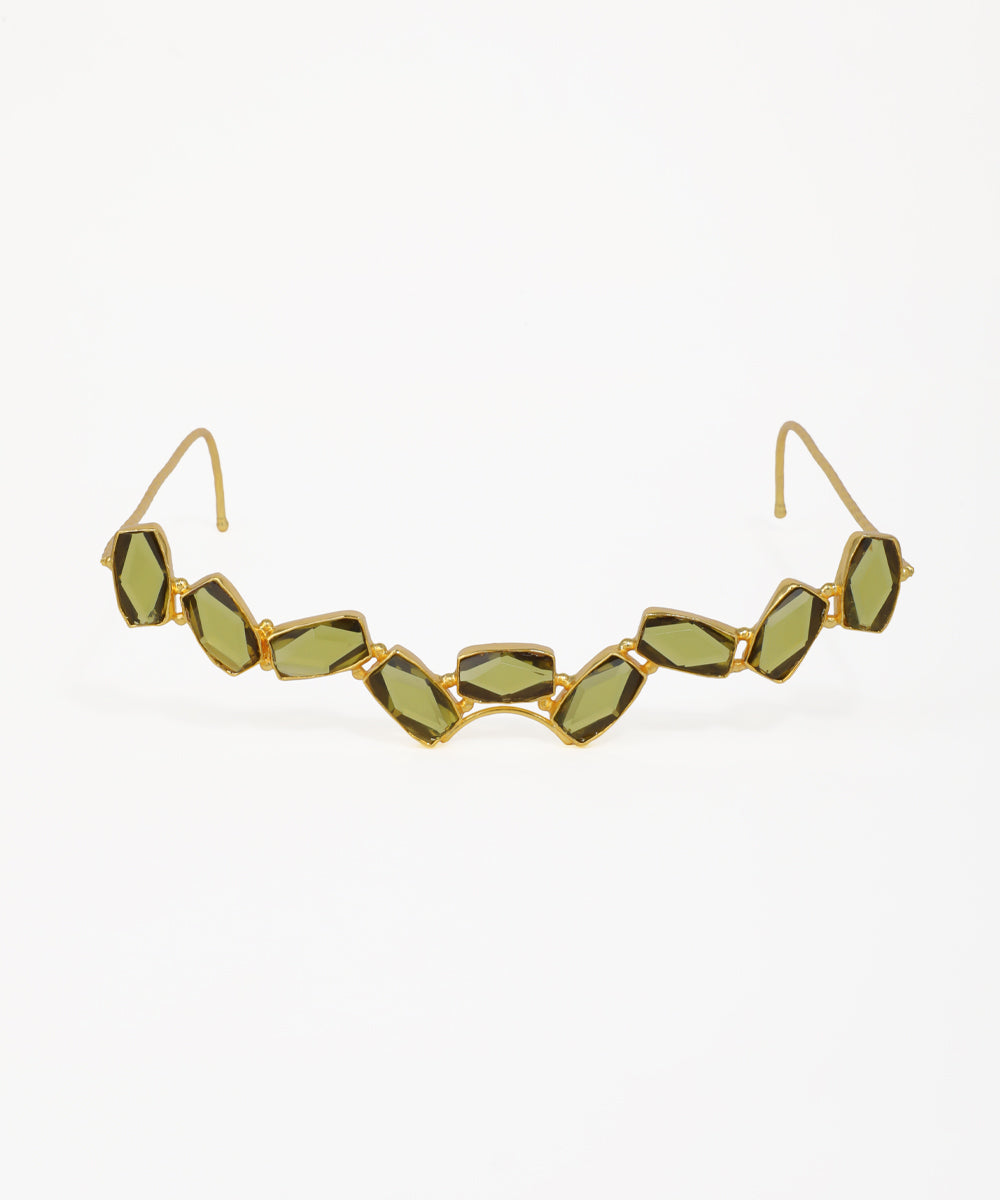 Gold-tone facelet with linked geometric green glass crystals