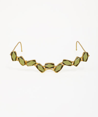 Gold-tone facelet with linked geometric green glass crystals