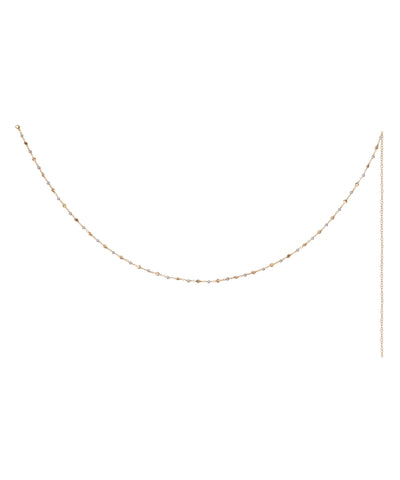 Gold-tone waist chain with small, irregularly shaped metallic beads and an extender chain