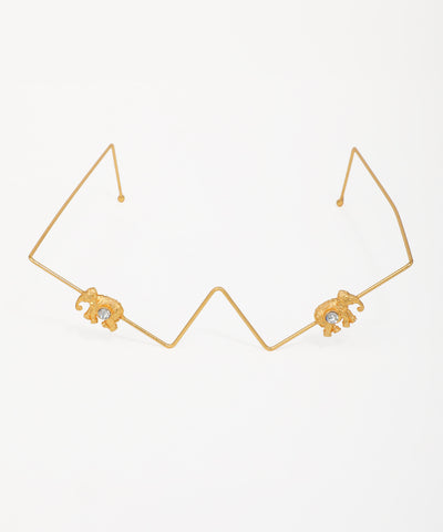 Gold-tone facelet with geometric wire and two elephant motifs, each with a clear stone accent