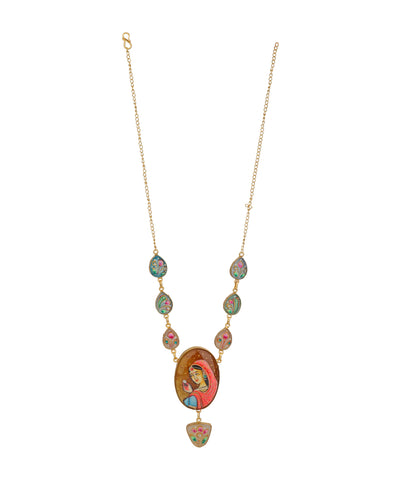 A gold-tone chain necklace featuring a colorful religious pendant with a central oval depiction of the Virgin Mary, flanked by small green and pink enamel stones, on a plain white background.