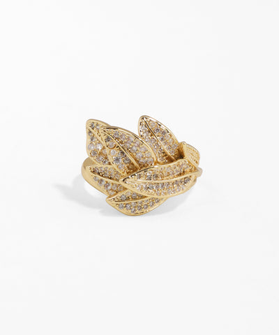 Gold ring with diamond accents on a white background