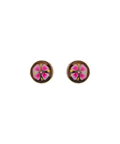 A pair of round stud earrings with a brown background and a pink and white floral design in the center, set against a plain white background.