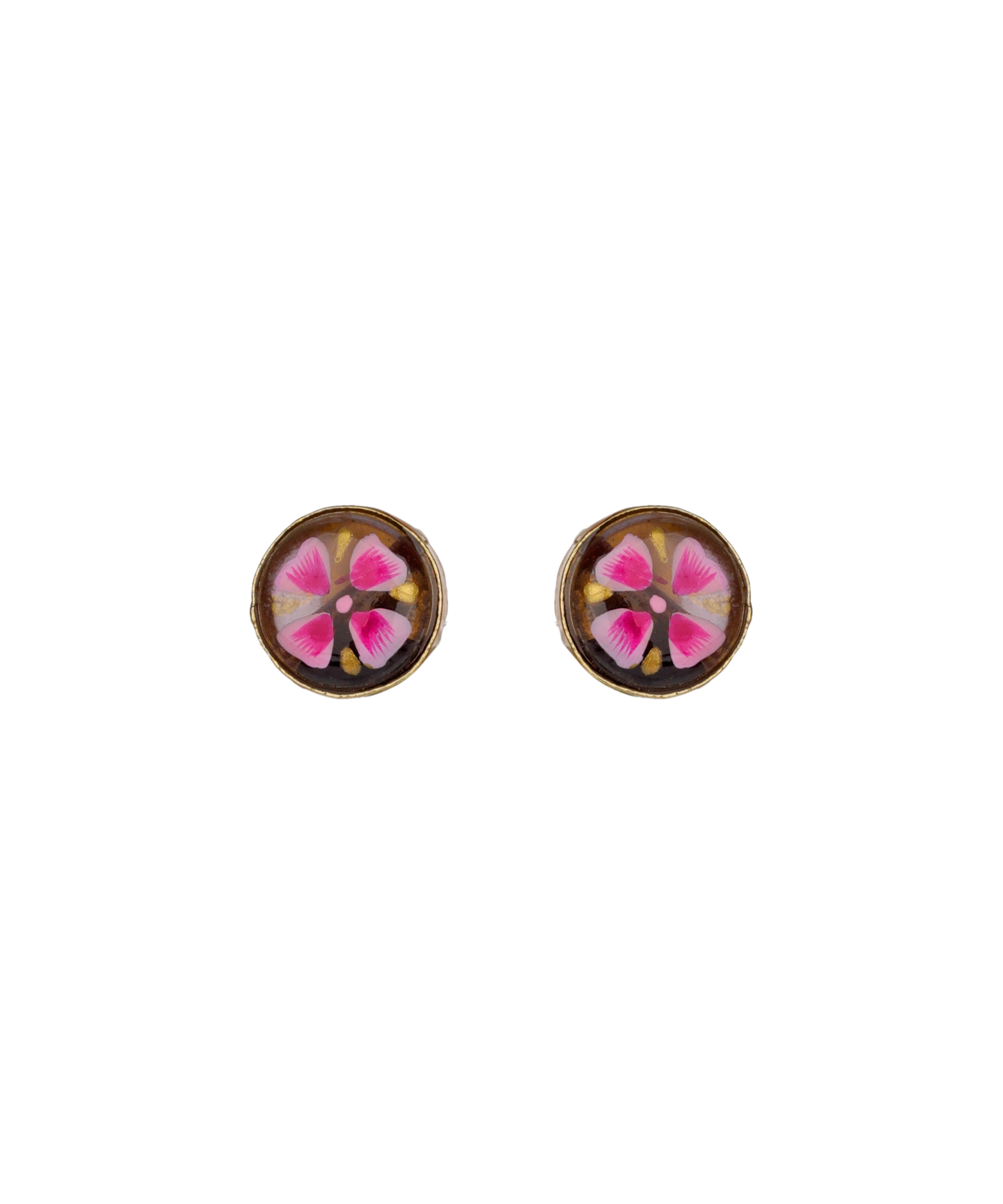 A pair of round stud earrings with a brown background and a pink and white floral design in the center, set against a plain white background.