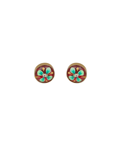 A pair of round stud earrings with a gold-tone metal border and a central floral design featuring turquoise green and red enamel details, set against a plain white background.