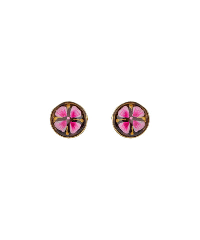 A pair of round stud earrings with pink and magenta floral designs set in a gold-tone metal, shown against a plain white background.