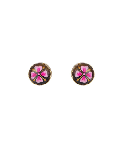 A pair of round stud earrings with a gold-tone border and a central pink flower motif on a dark background, shown on a plain white background.