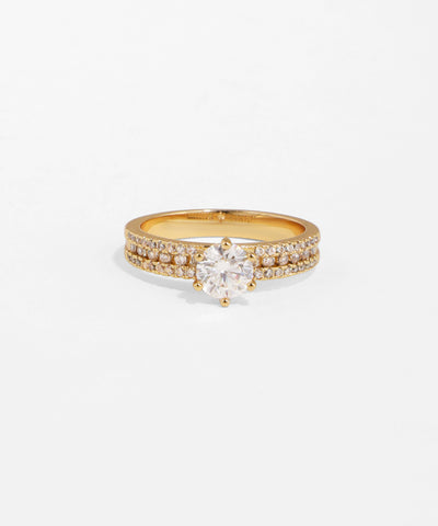 Gold ring with a diamond on a white background